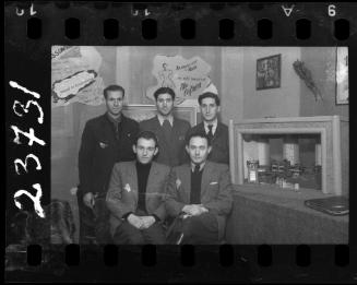 Six residents with Alta Zaifman poster in the backgroung