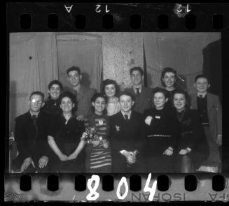 Group portrait of the bride and groom and their families at their wedding in the ghetto