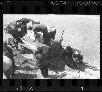 Residents unloading their belongings from a cart