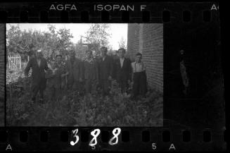 Residents standing in a vegetable garden in the ghetto