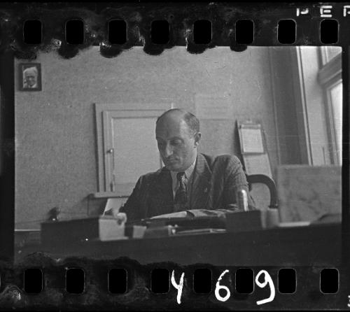 An administrator working at his desk