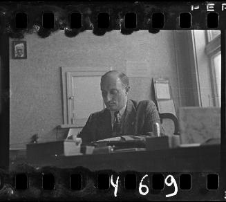 An administrator working at his desk