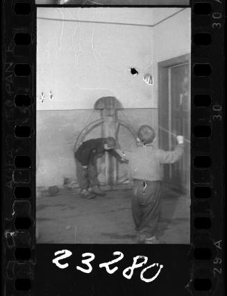 Two young boys in a workshop