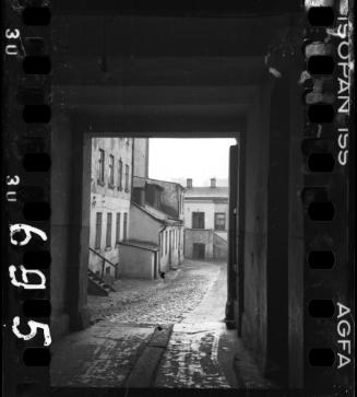Alley view onto unidentified buildings in ghetto