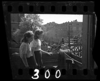 Two young women observing the bridge at Koscielyn Square, crossing Zigerska Street