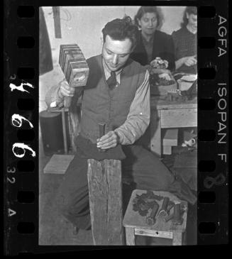 Man working in a ghetto workshop ("ressort")
