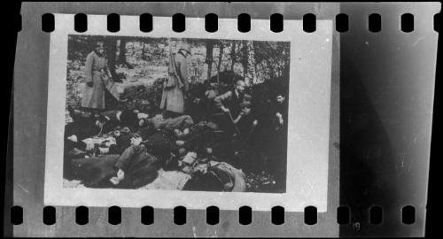"Under the eye of Nazi soldiers, and before their own execution: doomed Poles dig their own graves and those of others already murdered."