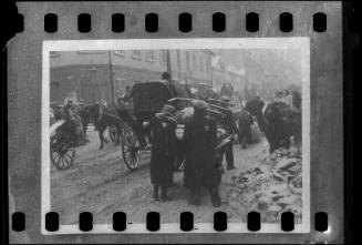 Residents transporting goods through the ghetto