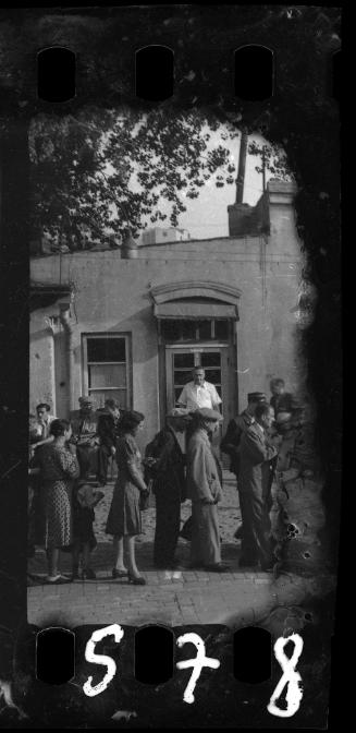 Line-up of ghetto residents in the street