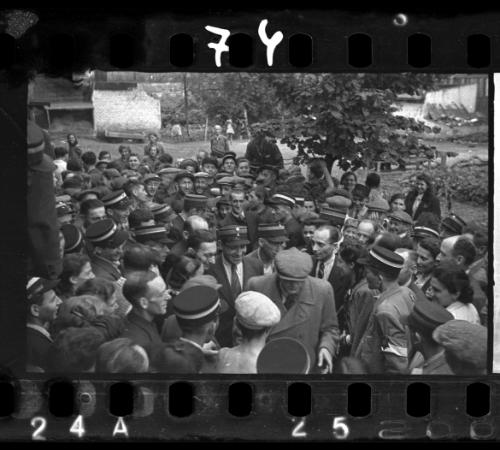 Mordechai Chaim Rumkowksi, "Elder of the Jews" and Chairman of the Judenrat, surrounded by large crowd of ghetto police and residents