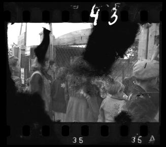 Residents standing outside the fence of the central prison on Czarnecki Street