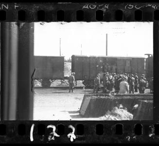“Radogoszcz Station from which ghetto Jews were transported to concentration camps, was situated  outside the boundaries of Lodz Ghetto. The right of entry was only for workers at the station.  I stole into the station with a group of railway workers. I was locked in a store room from where I was able to, through the hole in the wood, photograph this deportation [1944],”  -  Henryk Ross
