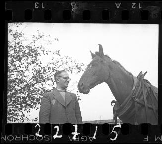 Dr. Kagan, hospital administrator, with a horse in the ghetto
