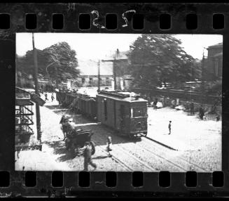 A streetcar carrying the belongings of Jews deported from the ghetto, across from the Catholic Church in Kosielny Square, where the Nazis collected down and feathers in bags taken from Jews