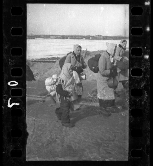 Two women walking with possessions being deported, Lodz Ghetto
