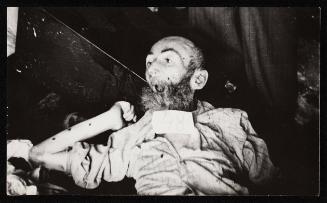 Body for burial tagged '48' - bald man with beard