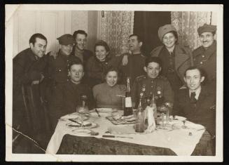 After liberation, group portrait of ghetto officials and wives