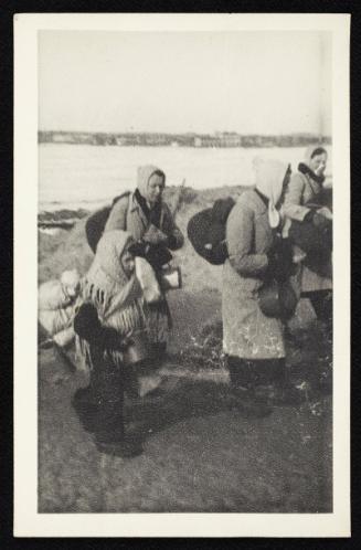 Girl in shawl and carrying pot, walking with deportation crowd