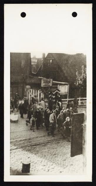 Deportation group walking across train tracks