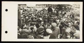 Chaim Rumkowski surrounded by large crowd of ghetto police and residents