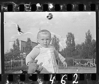 Portrait of a young boy with a toy