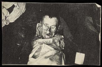 Body for burial tagged '541' - man with short, dark hair