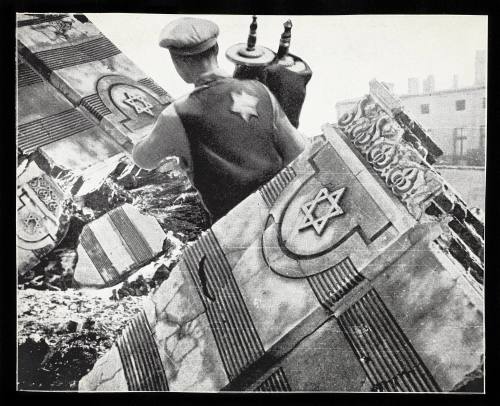 “Jew in the Ghetto saves Holy Scrolls.”  (p.21)