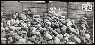 Crowd, line up at the Kuche No. 66 with a sign in Polish "woda sie nie nadaje do picia" water is not suitable for drinking