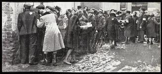 Soup kitchen line-up/ muddy street