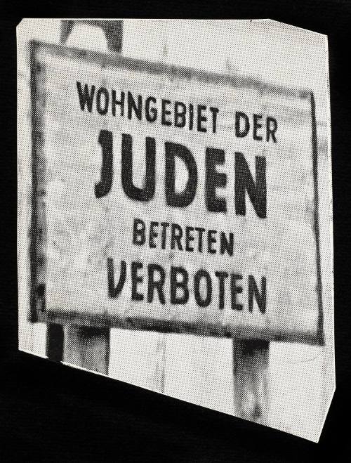 Sign: Wohngebiet der JUDEN betreten Verboten. “On the 8th of February 1940, 153 days after the German troops entered Lodz, police chief SS Brigadefuhrer Schaffer had posters put on the walls of the city announcing the establishment of the Ghetto, where all Jewish   inhabitants of Lodz had to be concentrated.” (p. 7)