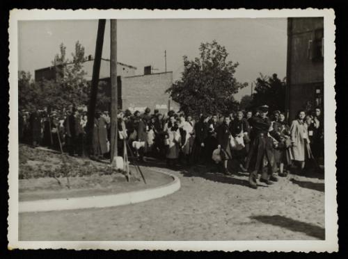 Mass deportation led by ghetto officials, approaching corner