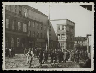 Residents gathered outside the hospital at 36 Lagiewnicka Street in the ghetto