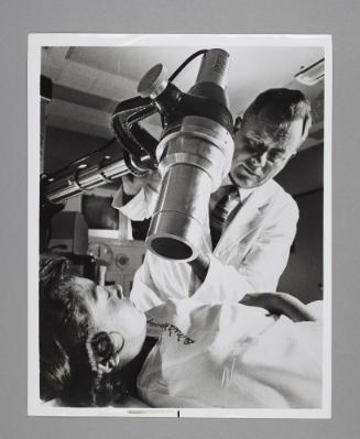 Detecting Disease with Atoms: Diagnostic Aid: A researcher measures the uptake of radioactive iodine in thyroid gland in a female patient