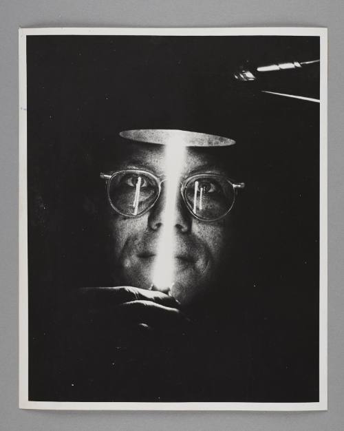 Science Works for Consumers: A scientist from the Oak Ridge National Laboratory holds a lamp devised to measure the smallest distances