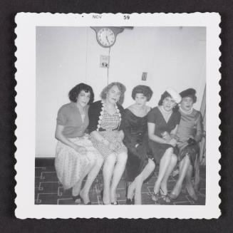 [Susanna, Dorothea, and three friends sitting under a clock, location unknown]
