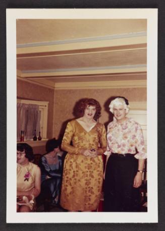 [Gloria and a friend standing together, location unknown]
