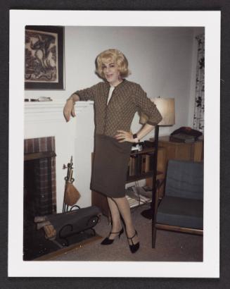 [Susanna standing by the fireplace, Casa Susanna, Hunter, NY]
