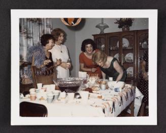 [Susanna and friends blowing out candles, location unknown]
