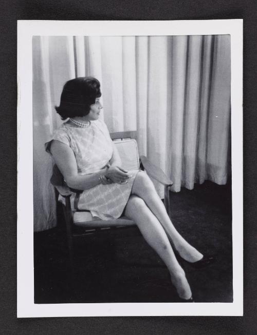 [Anita sitting on a chair in a hotel room, location unknown]
