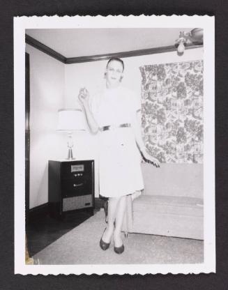 [Beverly without her wig, location unknown]
