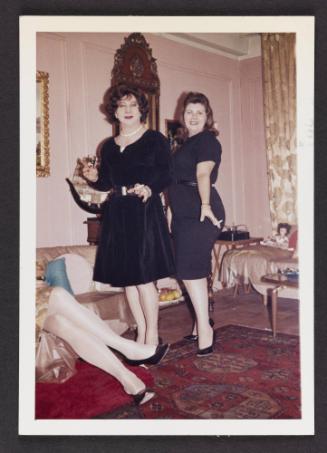 [Gail and friend in black dresses in Susanna and Marie’s New York City apartment]
