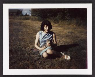 [Susanna in blue dress with cat, Casa Susanna, Hunter, NY]
