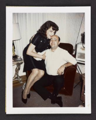 [Susanna and a man in a white shirt sitting on a chair, Casa Susanna, Hunter, NY]
