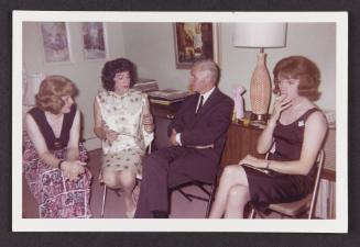 [Susanna, Donna (Buff/Cynthia) and two friends sitting in the living room, location unknown]
