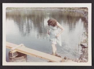 [Susanna in a blue-and-white polka-dot dress, wading in the water, Casa Susanna, Hunter, NY]
