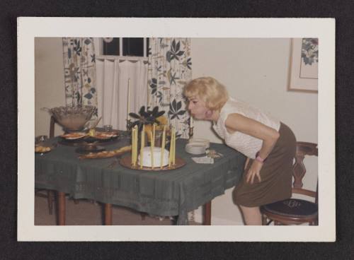 [Susanna blowing out birthday candles, Casa Susanna, Hunter, NY]
