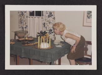 [Susanna blowing out birthday candles, Casa Susanna, Hunter, NY]
