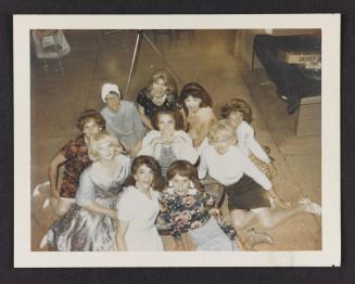 [Group portrait with Susanna, Marie, Jody, Lili, Ann and friends on the floor, location unknown]
