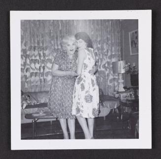 [Susanna and Dorothea hugging in the living room in Susanna and Marie’s New York City apartment]
