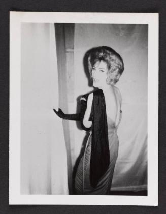 [Brunette in long black gloves, location unknown]
